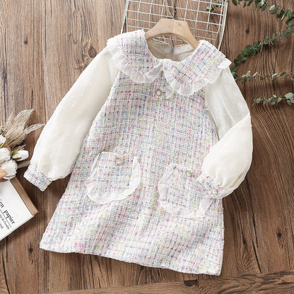 Delicate children's dress with lace and pearl buttons