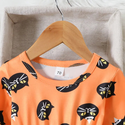 Orange children's dress with black cat