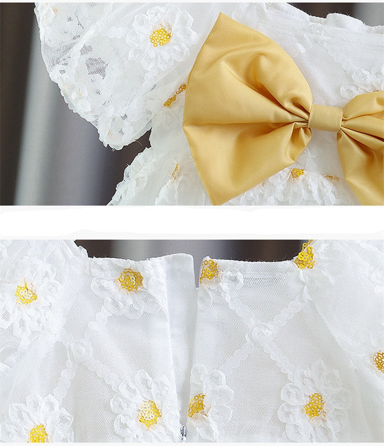 Children's dress with yellow bow