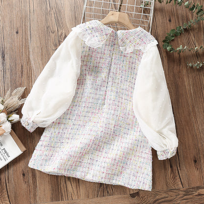 Delicate children's dress with lace and pearl buttons