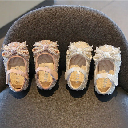 Children's shoe with glitter and bow