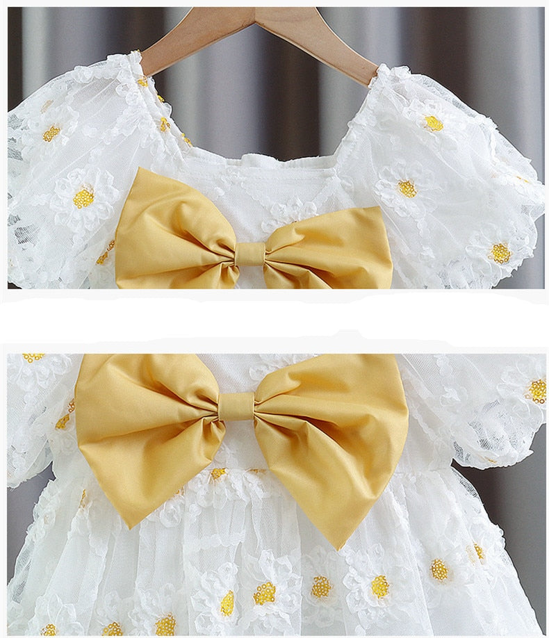 Children's dress with yellow bow