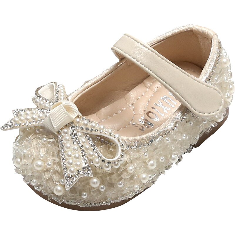 Children's shoe with glitter and bow