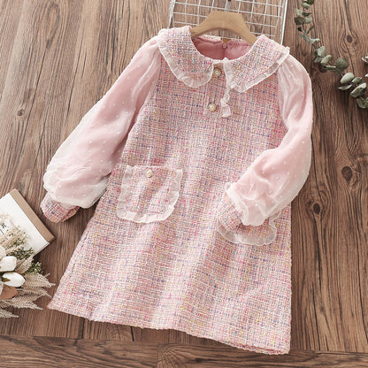 Delicate children's dress with lace and pearl buttons