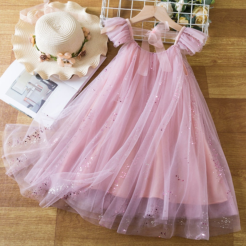 Children's dress in delicate tulle with glitter