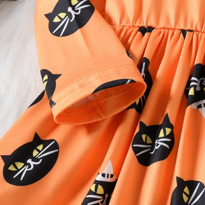 Orange children's dress with black cat