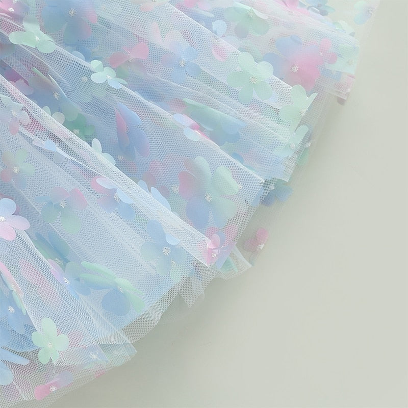 Children's blue tulle dress with colorful flowers